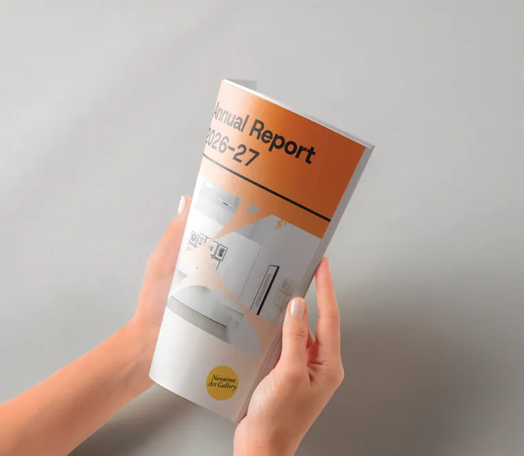 Annual report cover held in hand